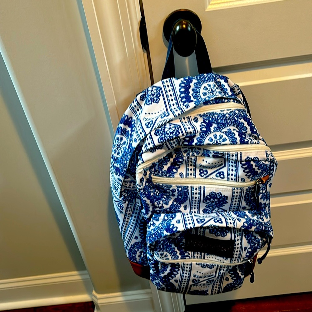Blue and white Jansport backpack